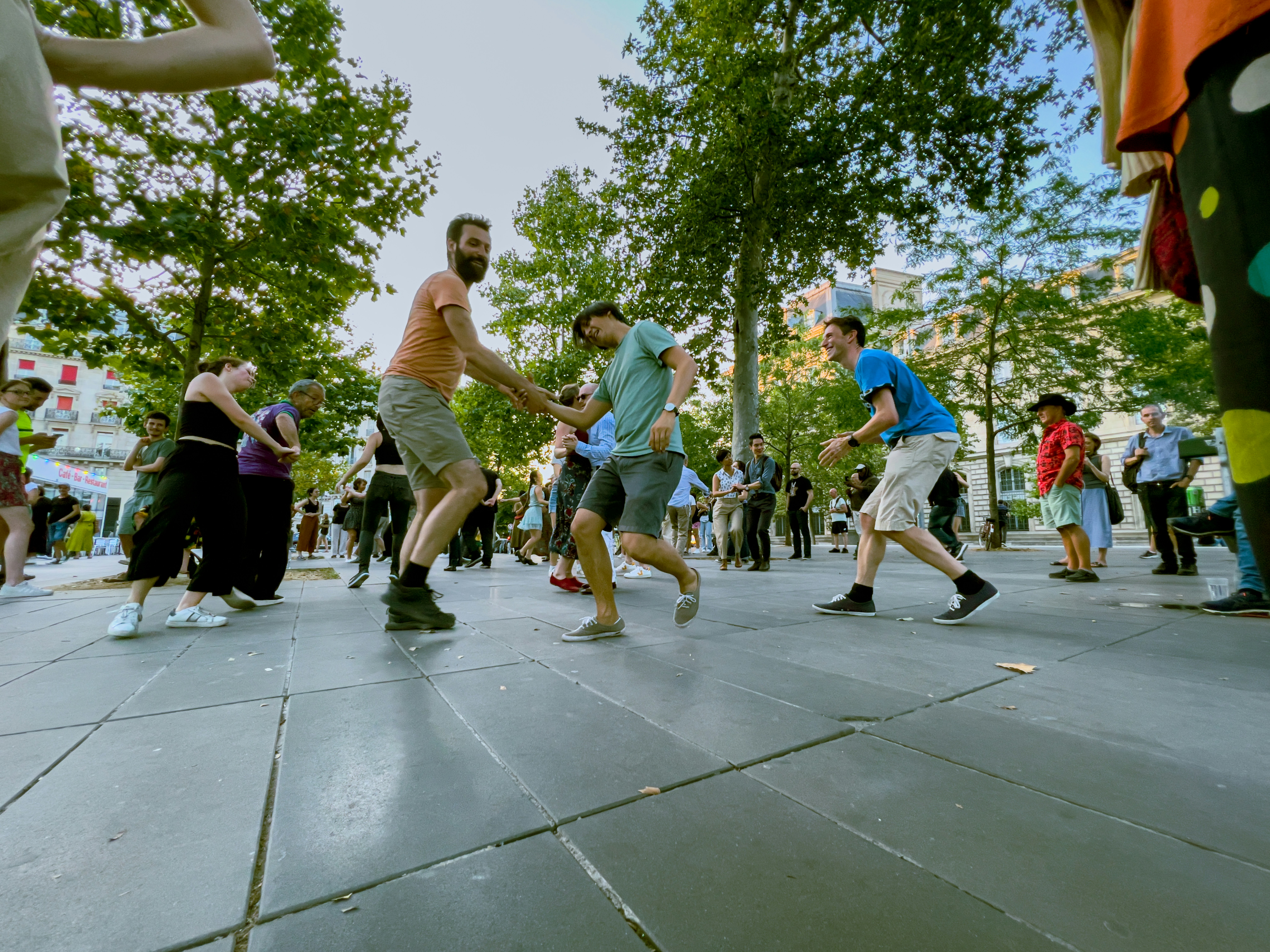 People dancing in a park during daytime