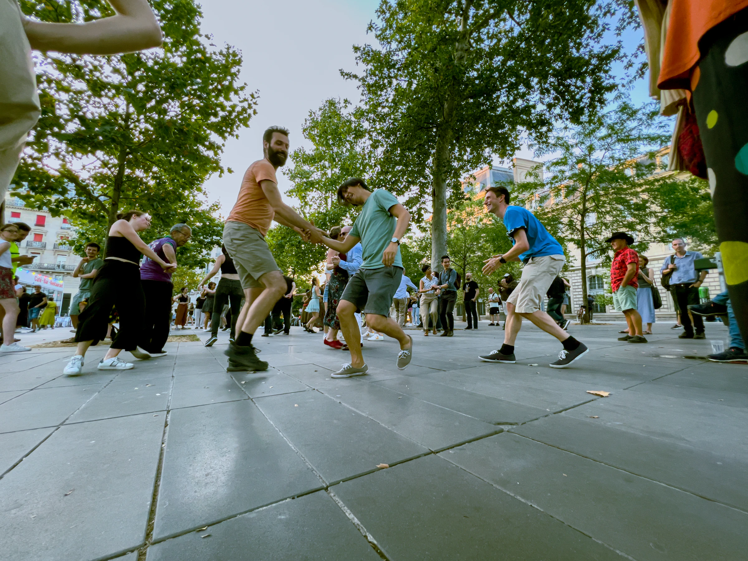 People swing dancing together in a park