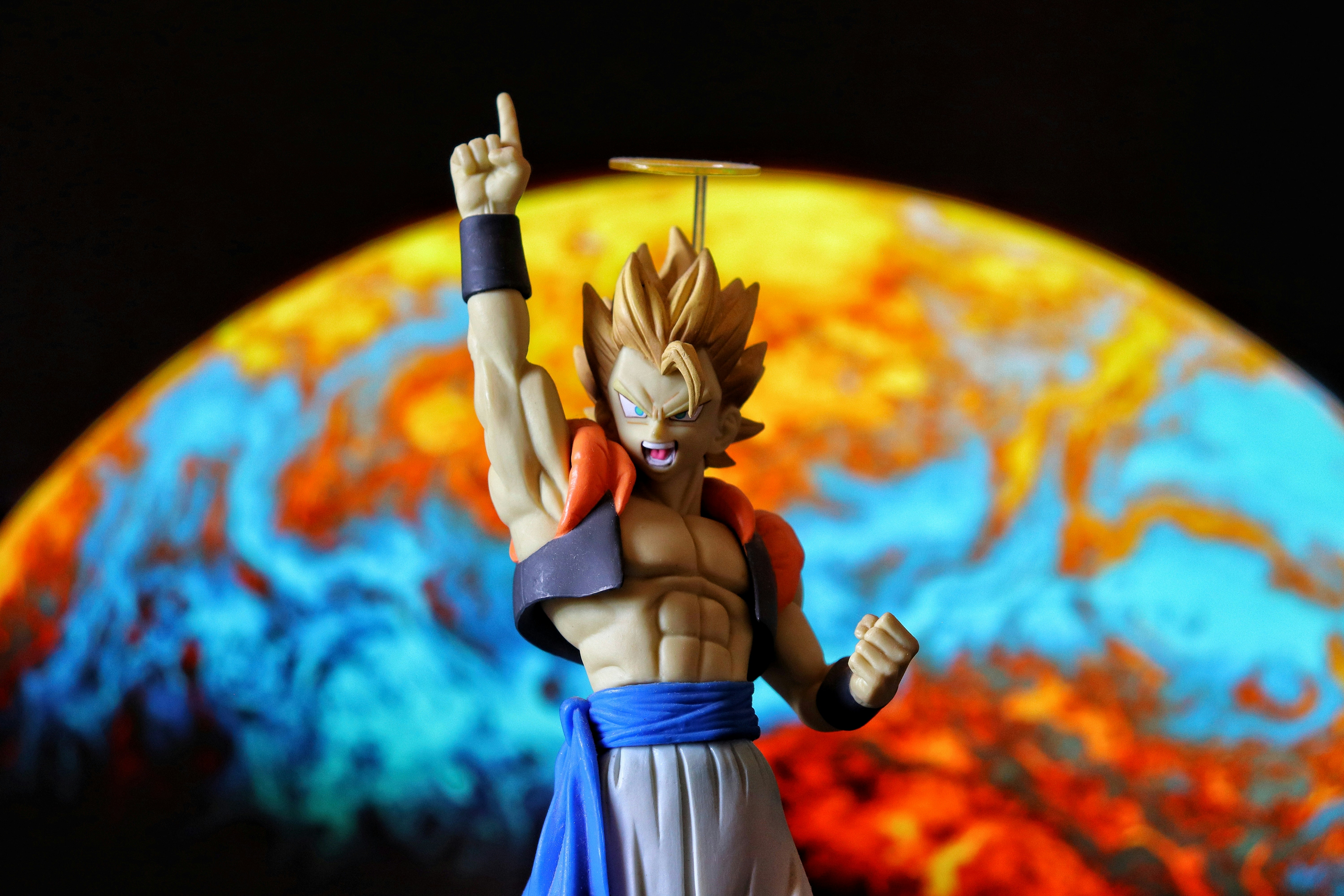 Gogeta figure with a planet in the background