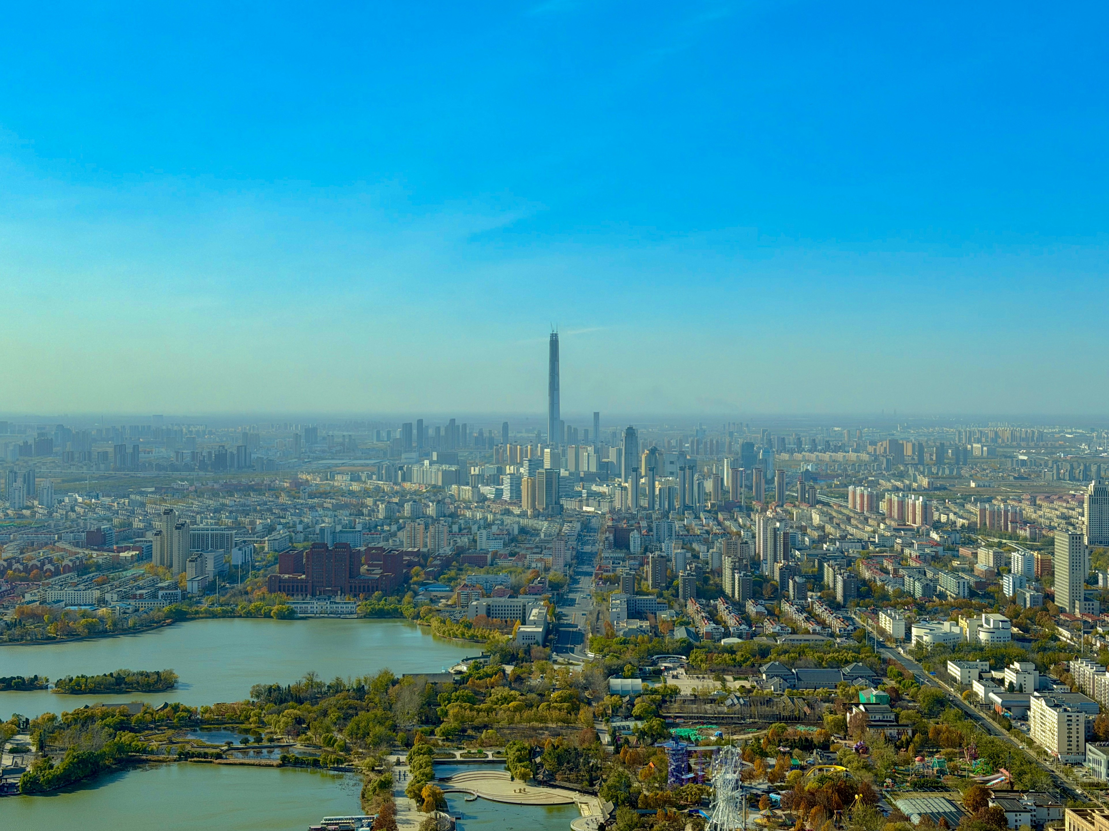 Expansive cityscape with tall buildings and a clear blue sky