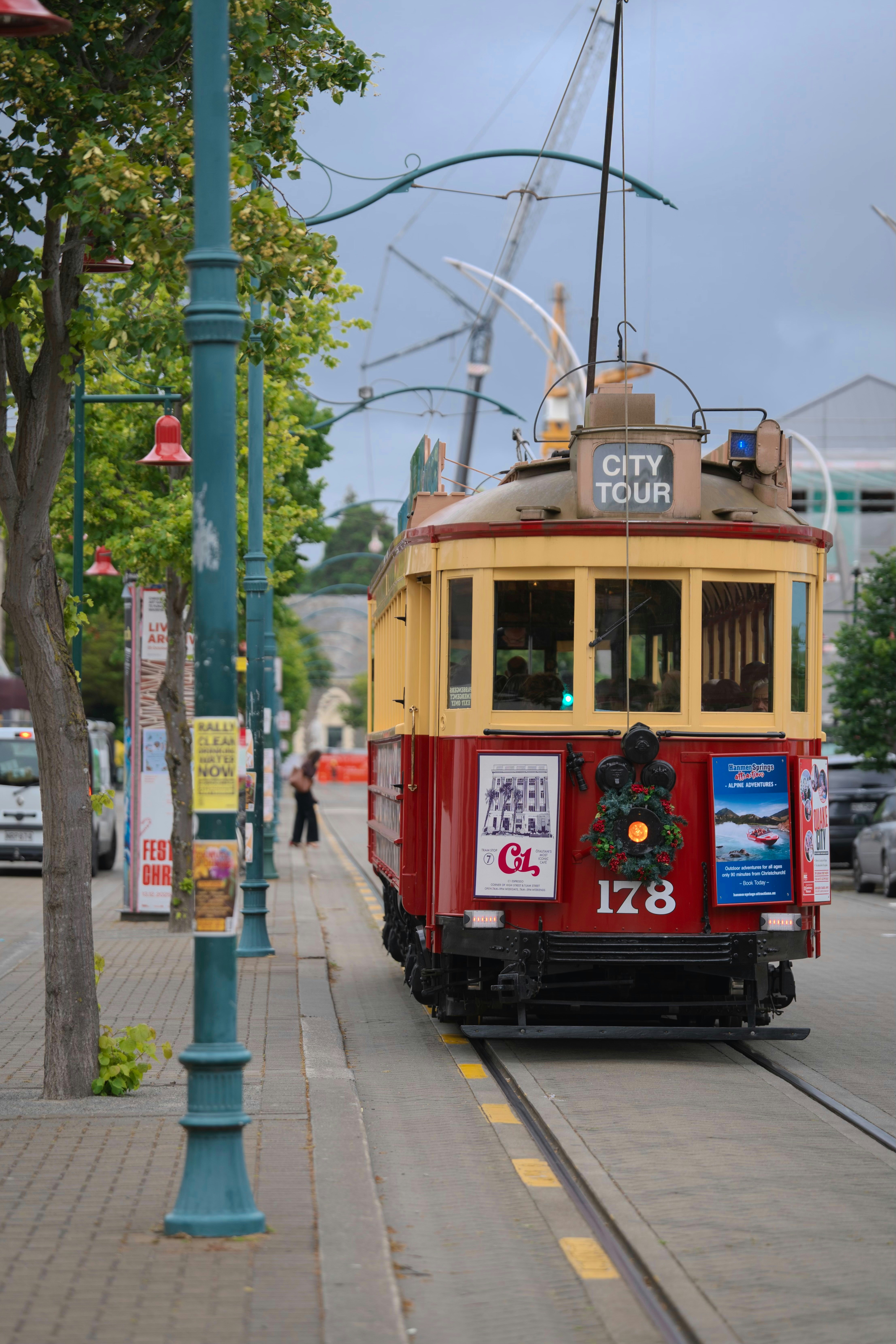 A vintage tram labeled "city tour" on tracks.