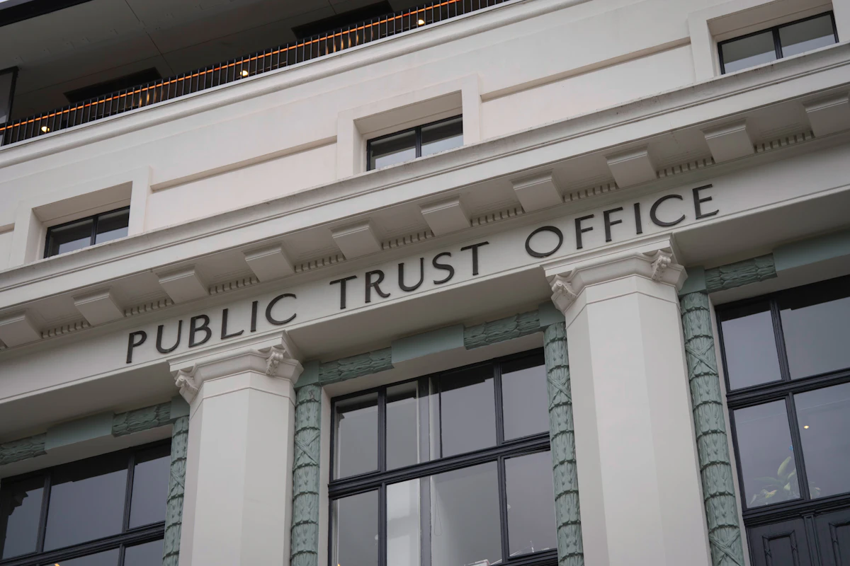 Classical stone facade of a financial institution building with columns, representing stability in wealth management