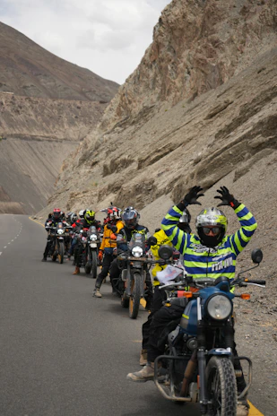 Group of motorcyclists riding on a mountain road