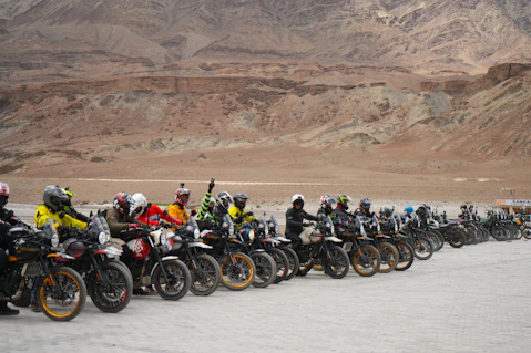 Motorcyclists lined up in a desert landscape