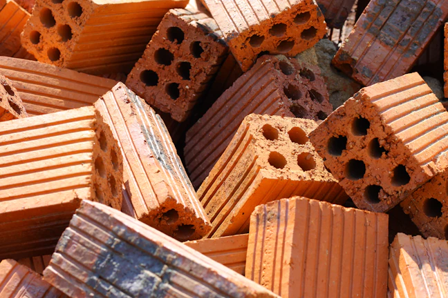 Pile of orange bricks with holes