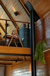 Modern interior with wooden walls and a mezzanine