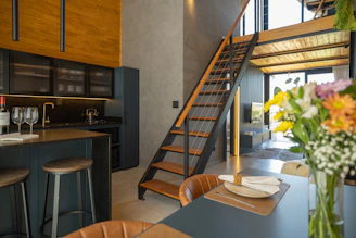 Modern kitchen with loft and staircase