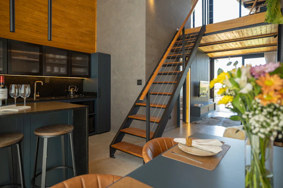 Modern kitchen with loft and staircase