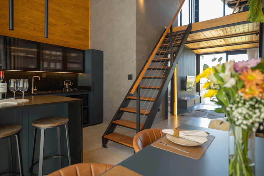 Modern kitchen with loft and staircase