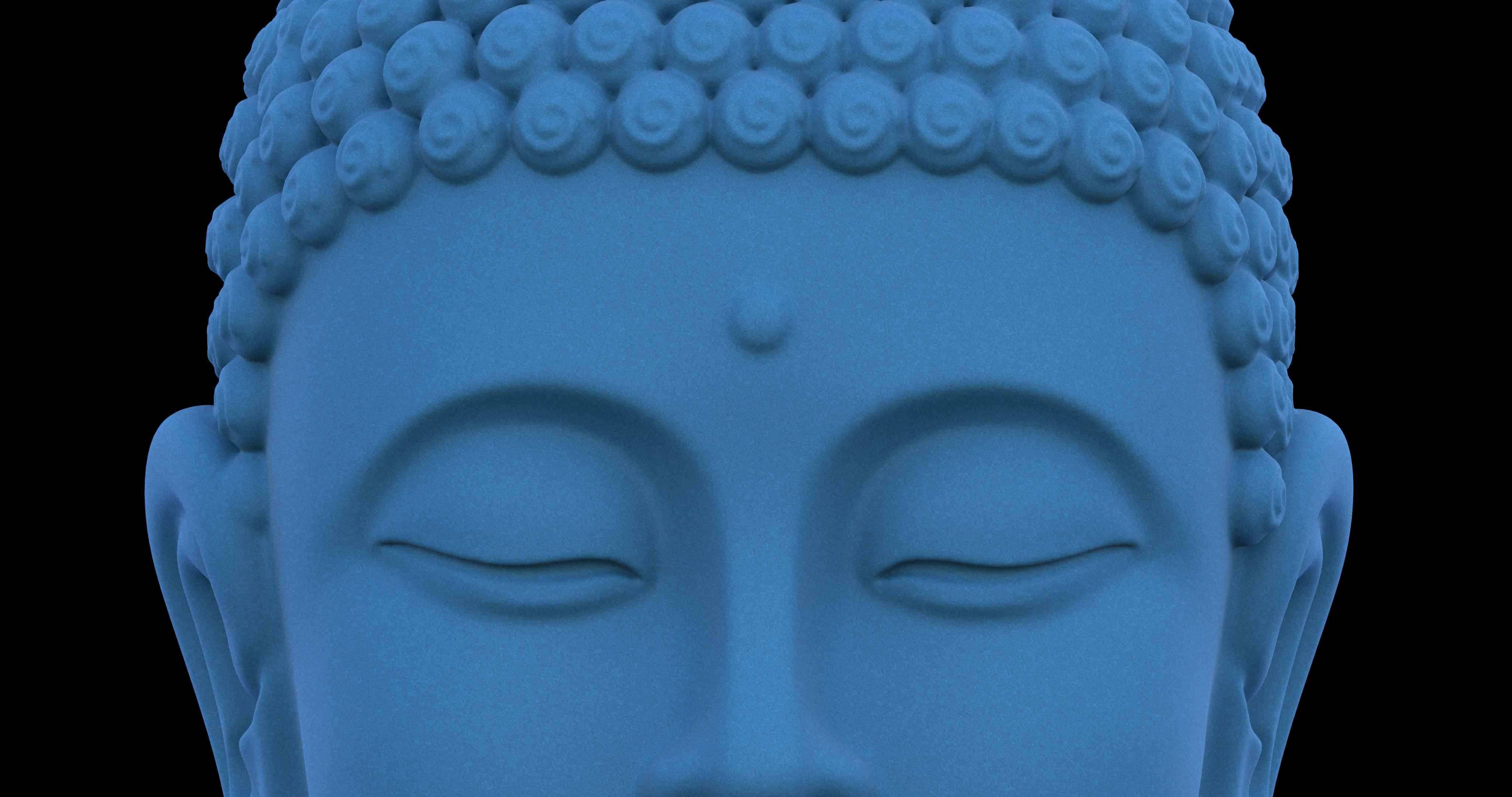 Un primer plano de la cabeza de una estatua azul de Buda