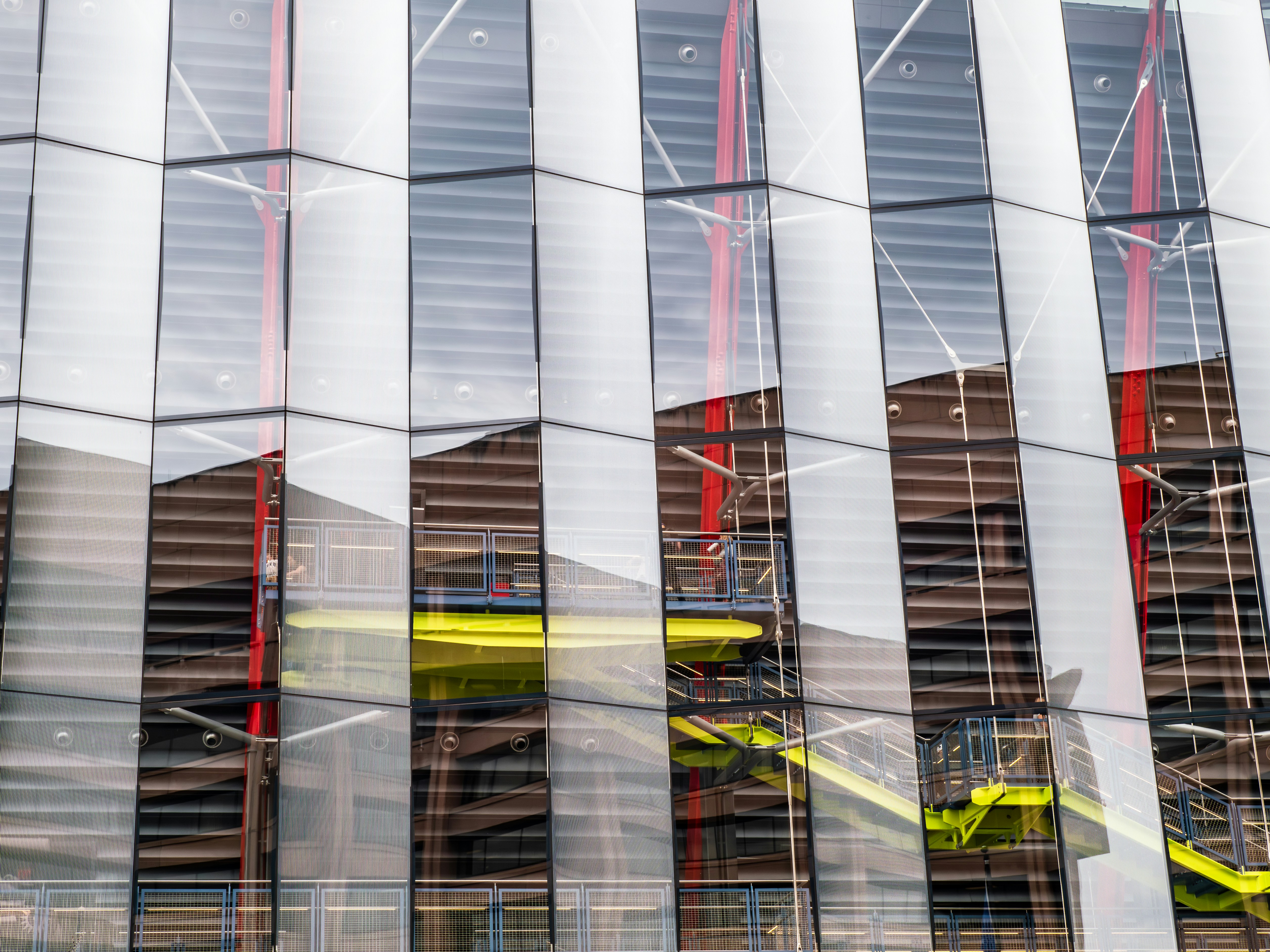 Modern building facade with glass and red accents