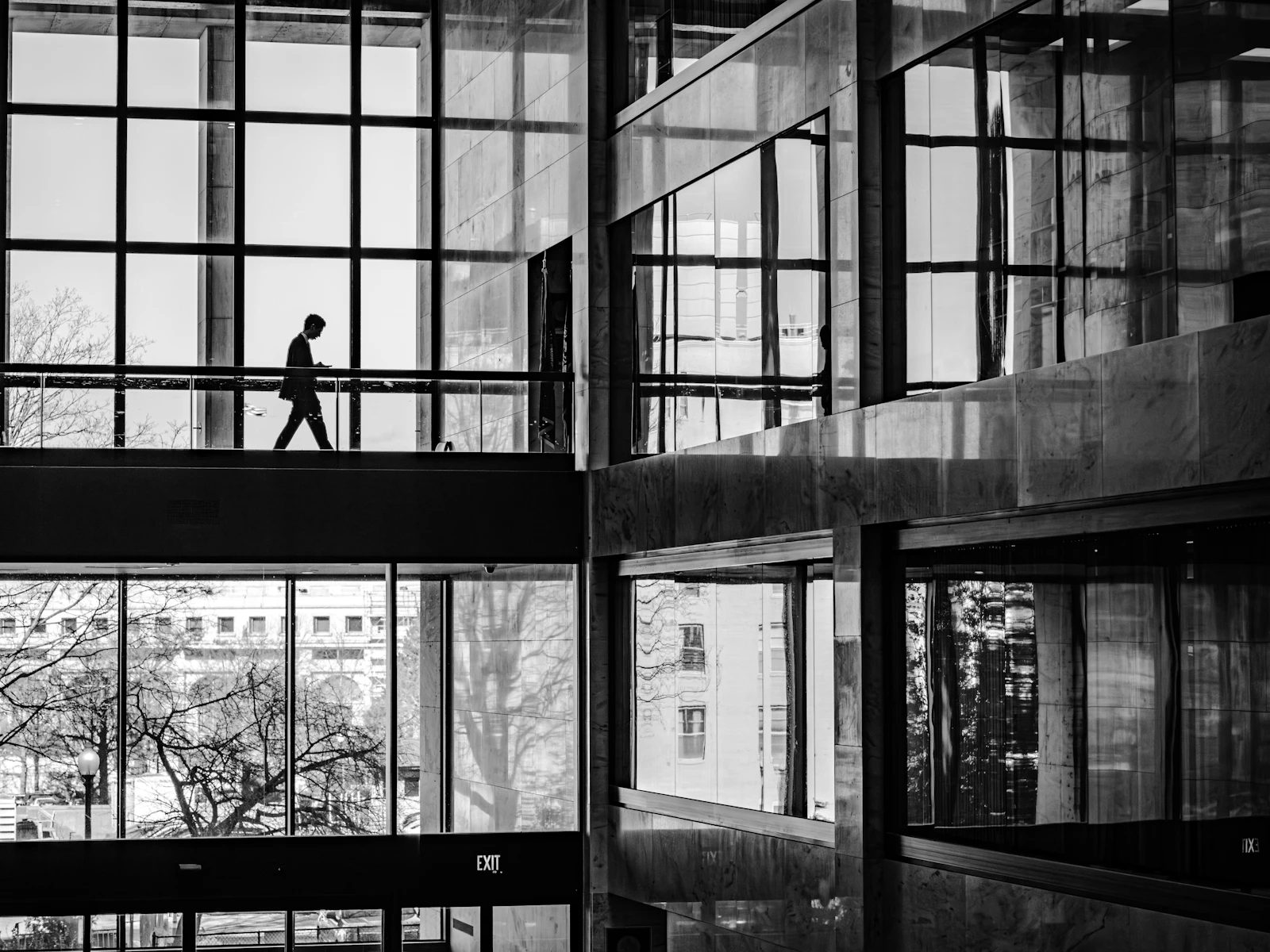 A person walking through a modern institutional building