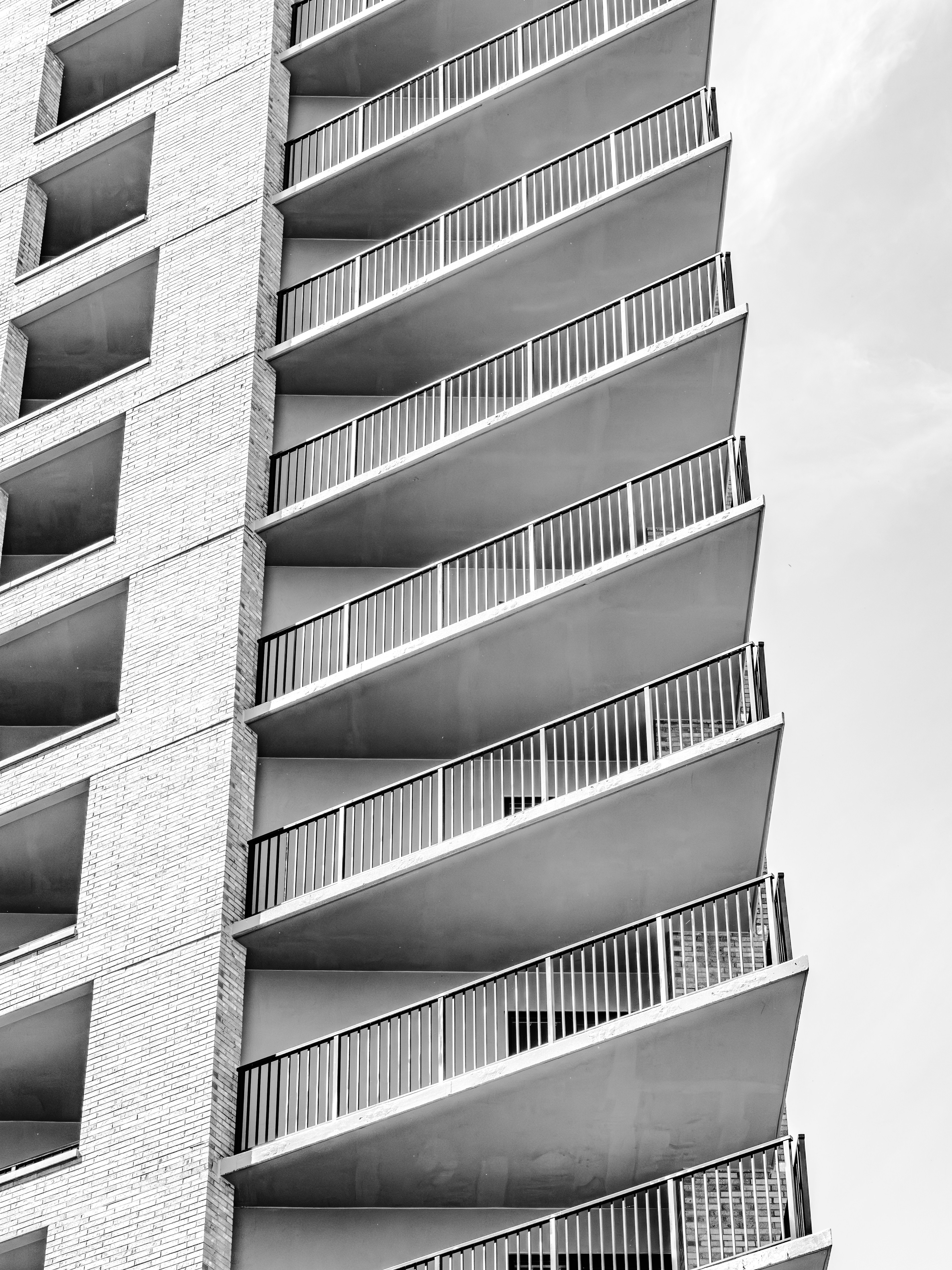 Modern building with repeating balconies against sky