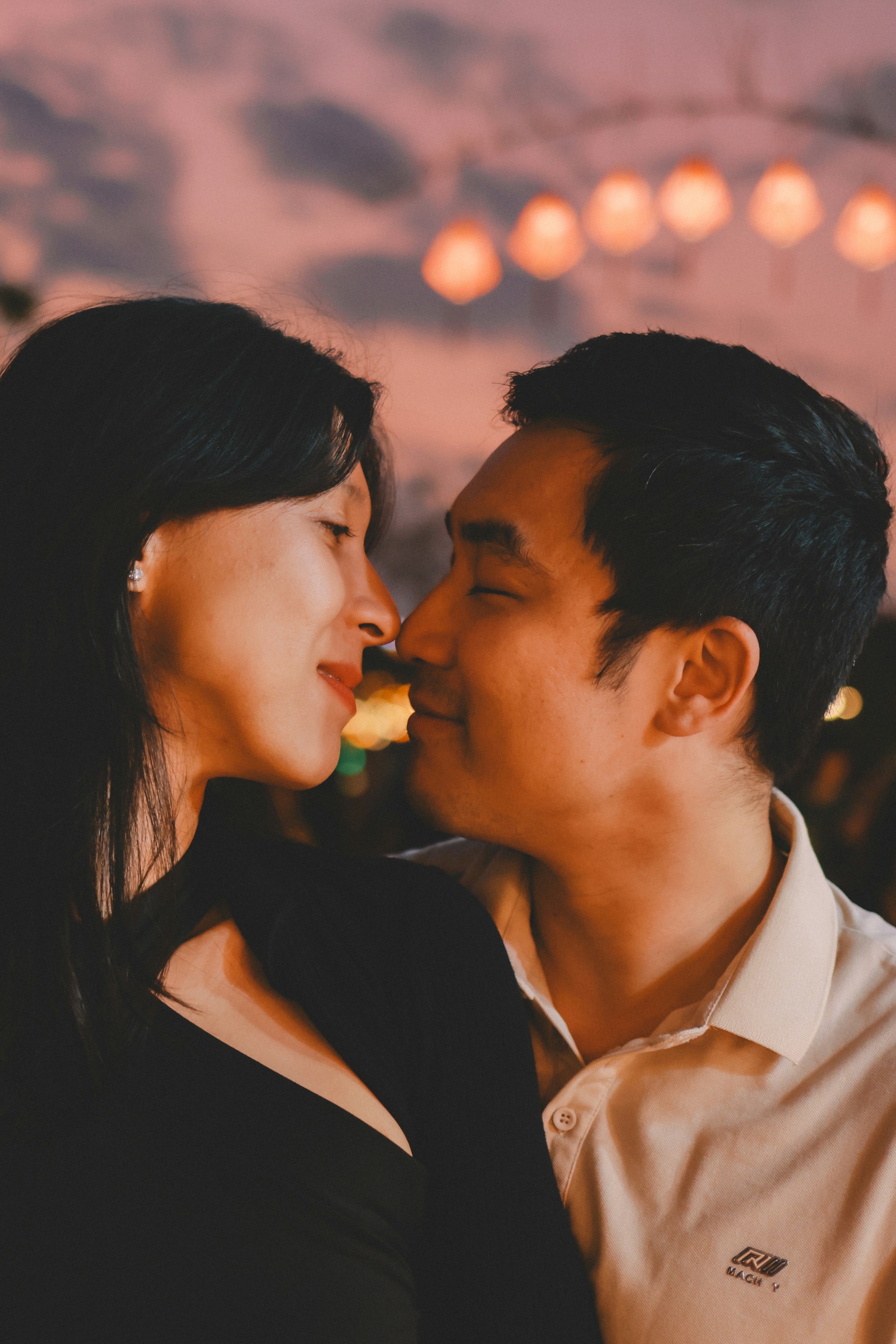 Couple sharing a tender moment at dusk