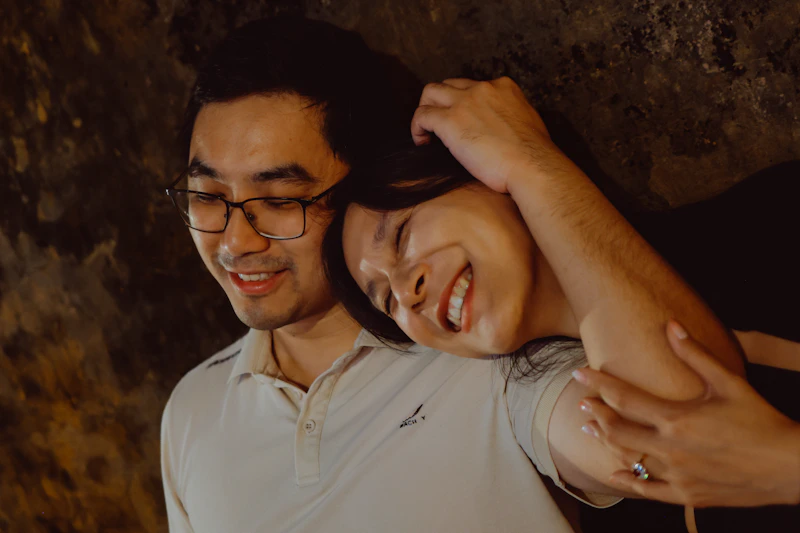 STD-positive couple smiling together outdoors