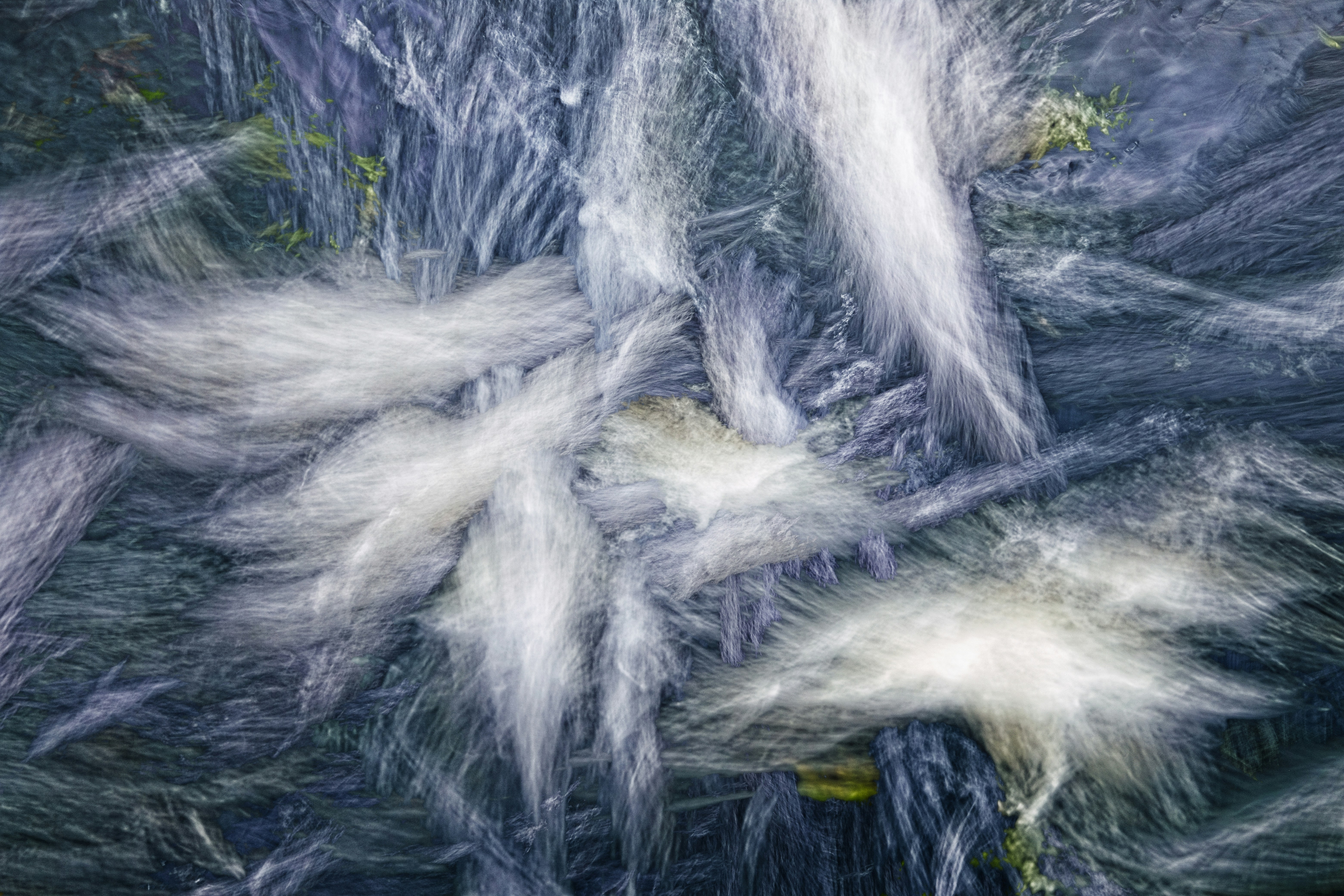 Abstract streaks of white against a dark, textured background