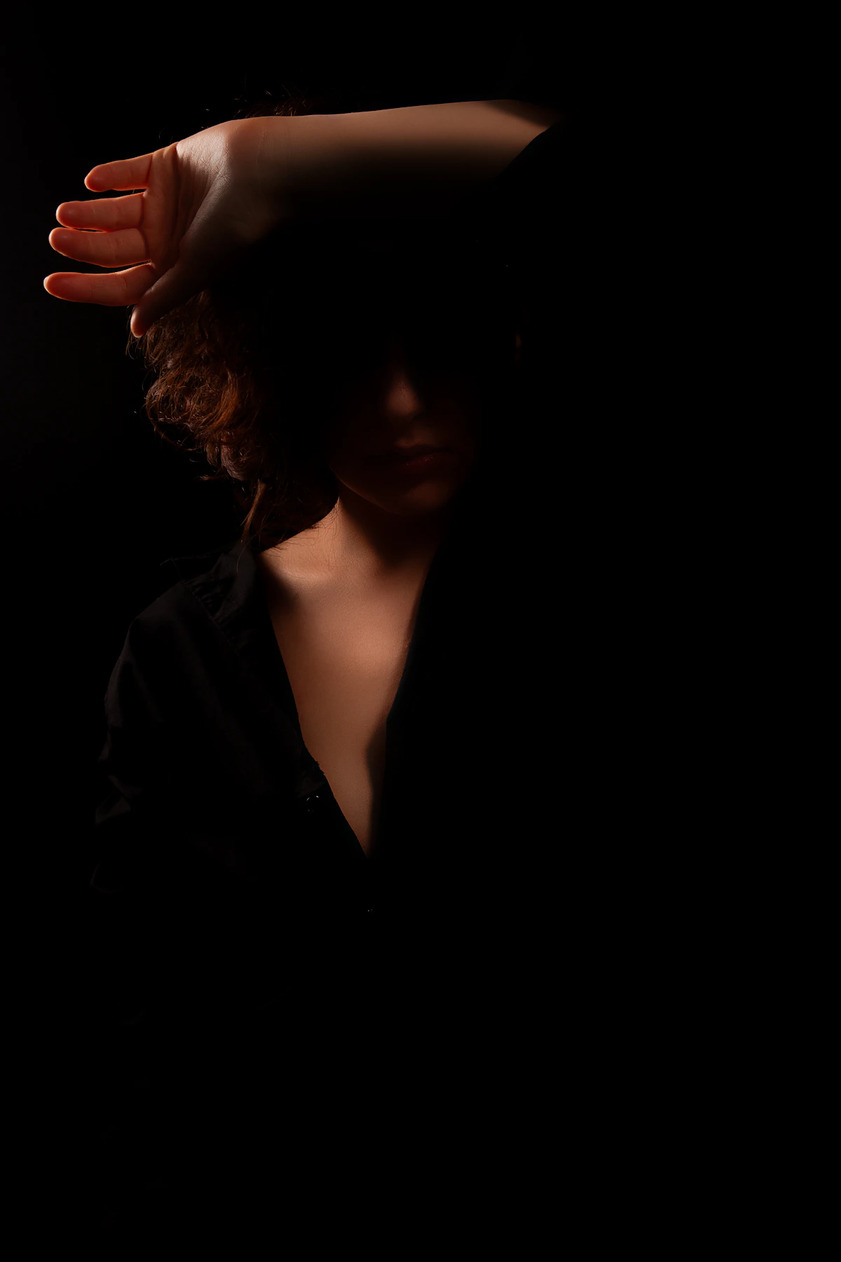 Aesthetic creator portrait with face hidden by a hand