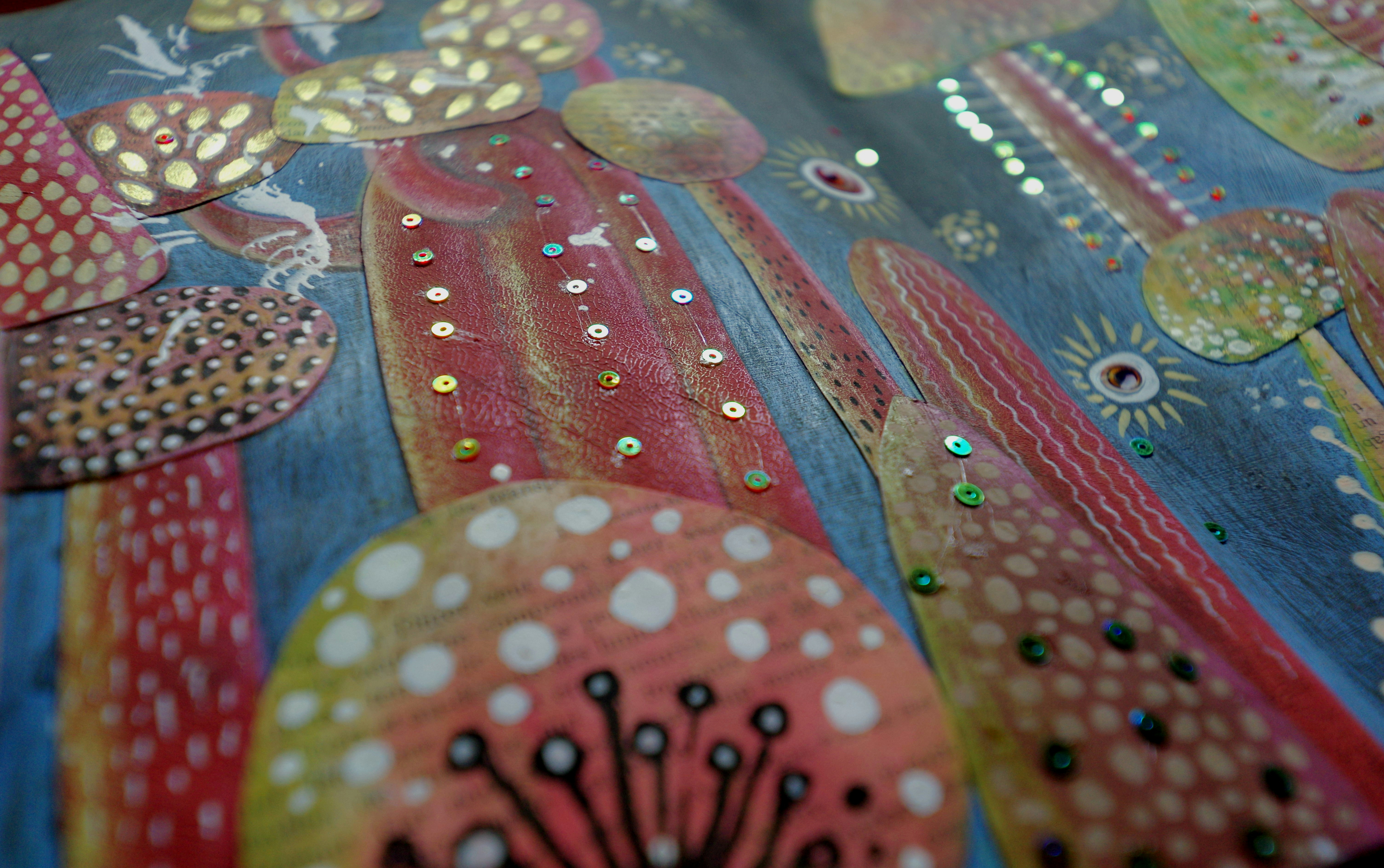 Close-up of colorful, textured abstract art with dots