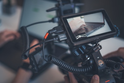 Camera monitor showing a laptop and cables