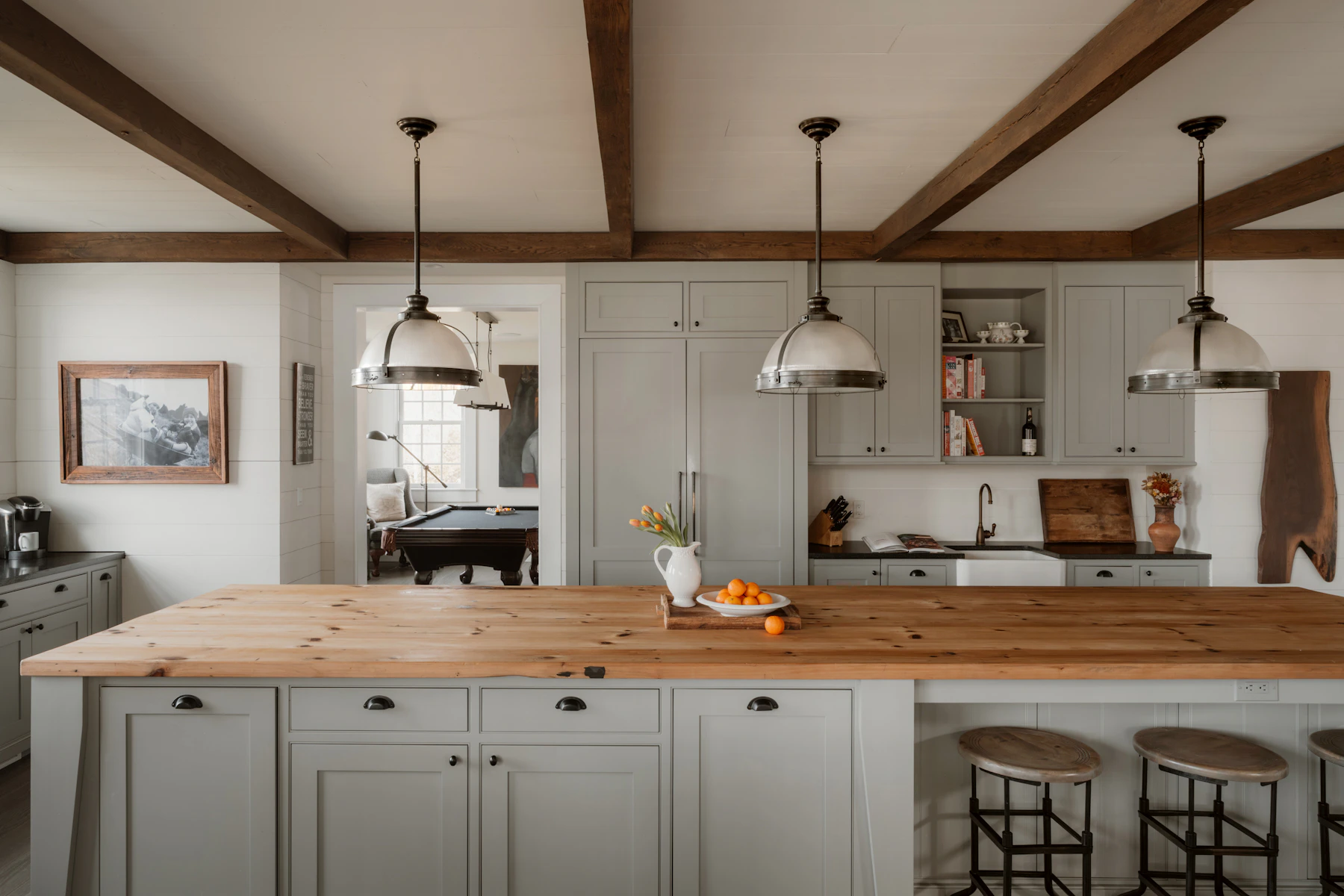 Modern farmhouse kitchen with a central island, pendant lights and generous work surfaces