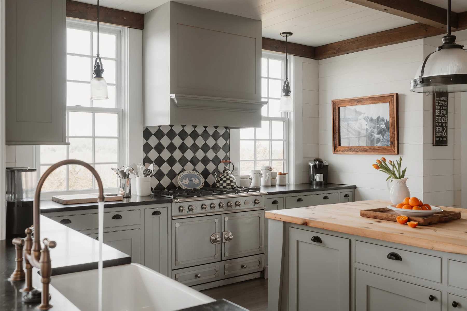 Farmhouse kitchen with island, cabinets and naturally lit work surfaces