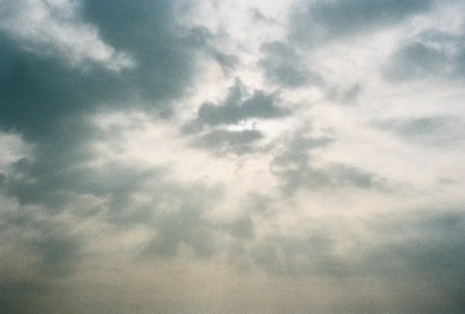 Sunlight breaking through dramatic storm clouds