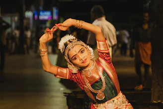 Young dancer in traditional indian costume performs gracefully.