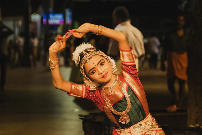 Young dancer in traditional costume holding a graceful pose outdoors