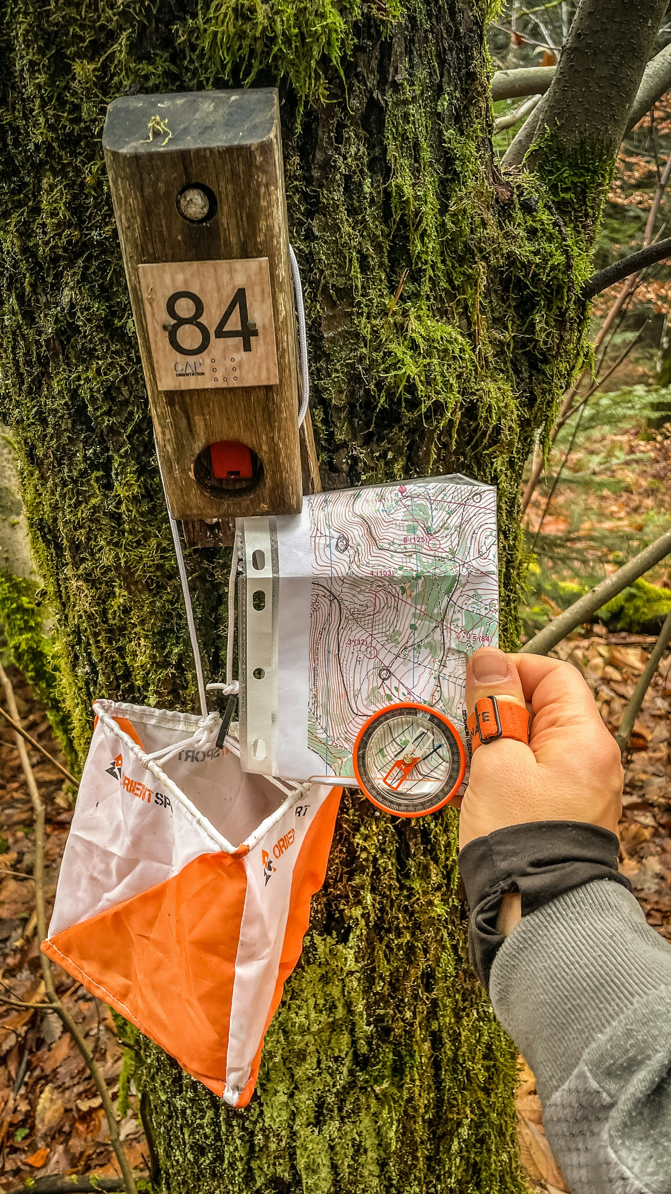 Orienteering control point with map and compass