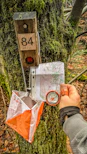 Orienteering control point with map and compass