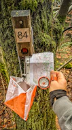 Orienteering control point with map and compass