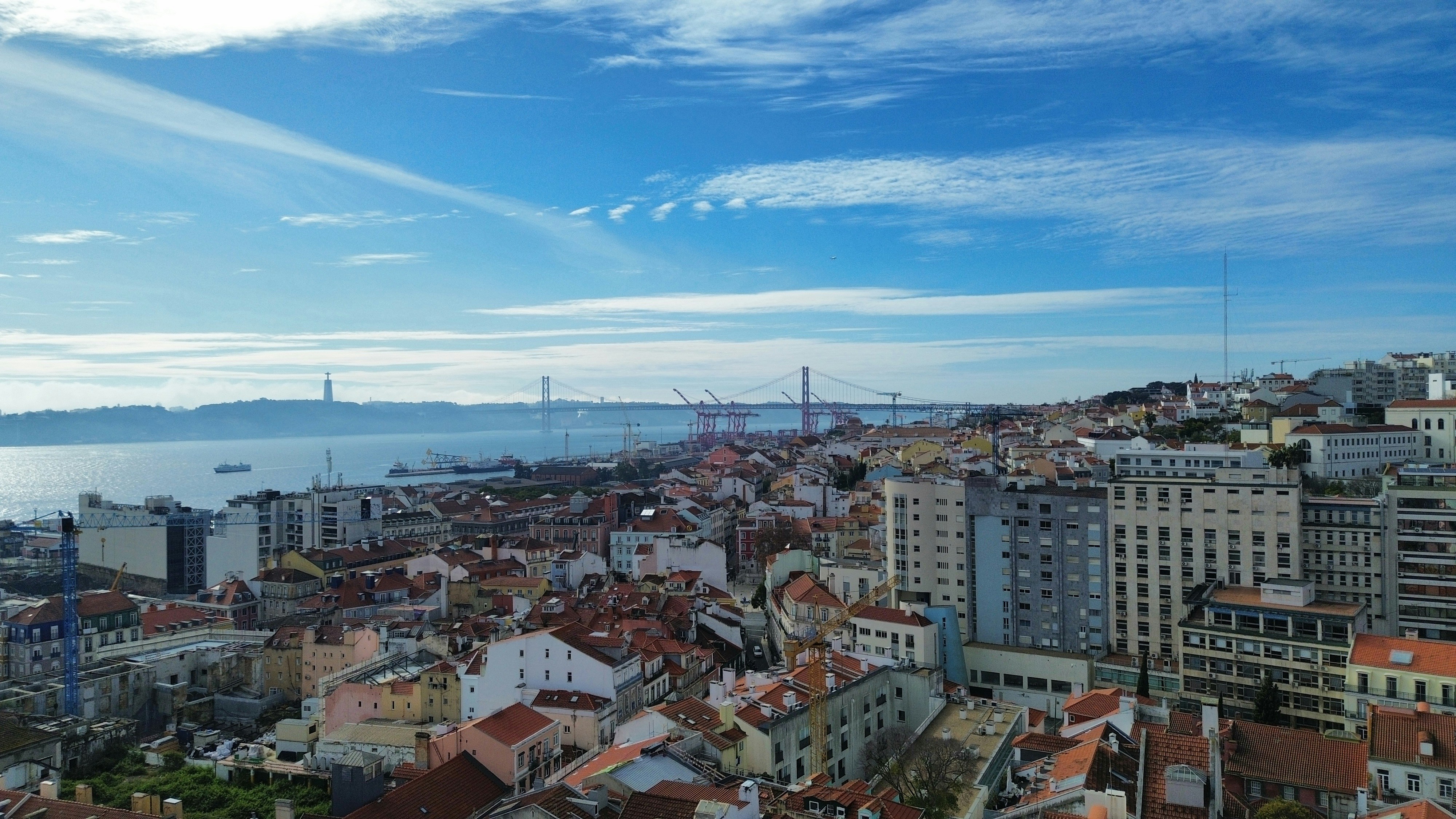 City skyline with a bridge over the water.