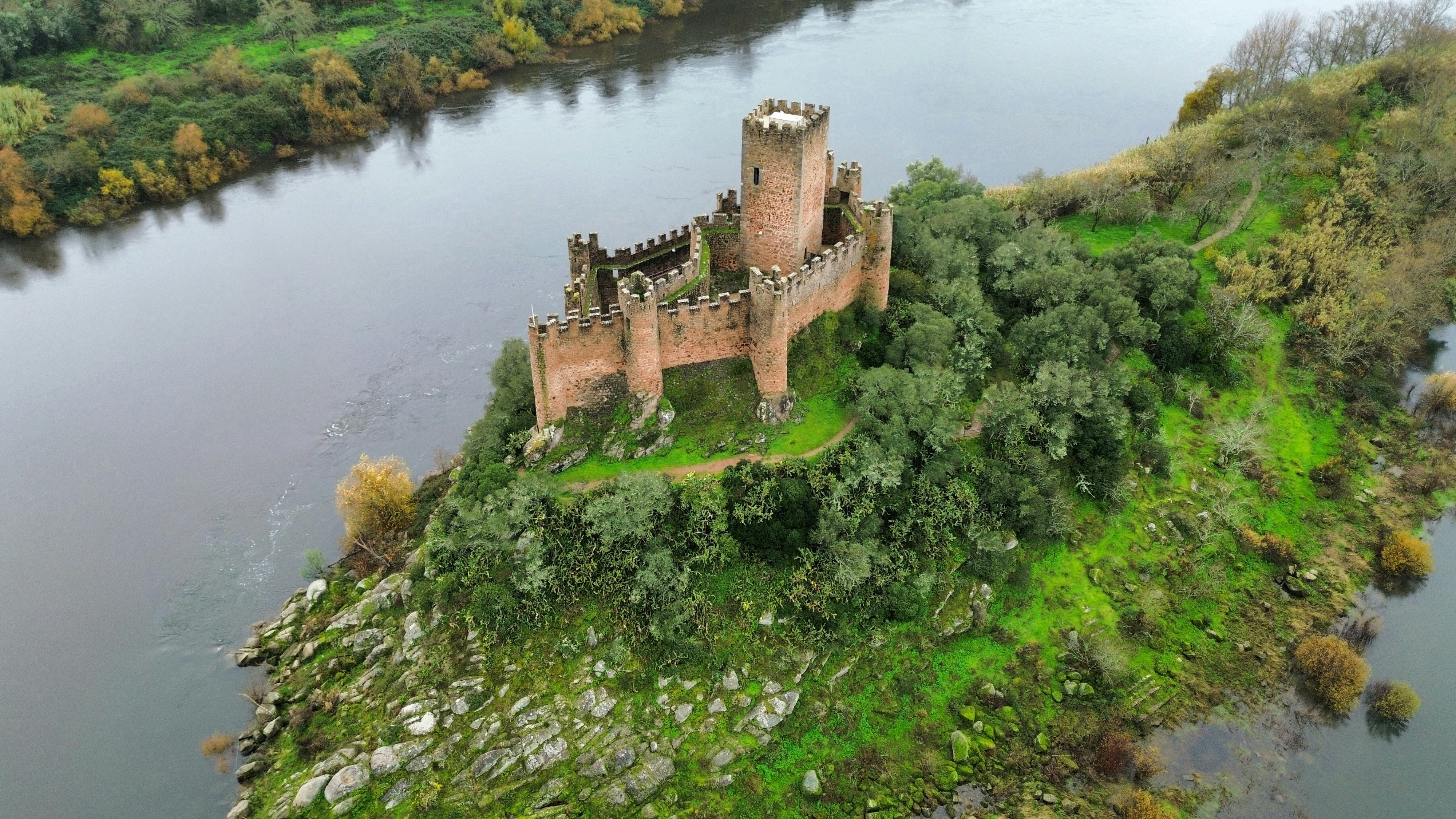 Castle Ruins On A Small Island Surrounded By Water