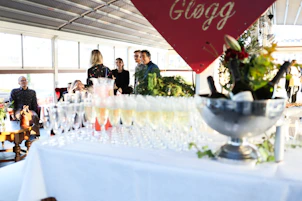 Champagne glasses and bottles on a table at an event.