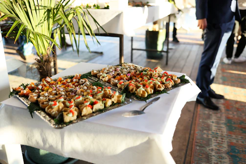 Two trays of appetizers on a table