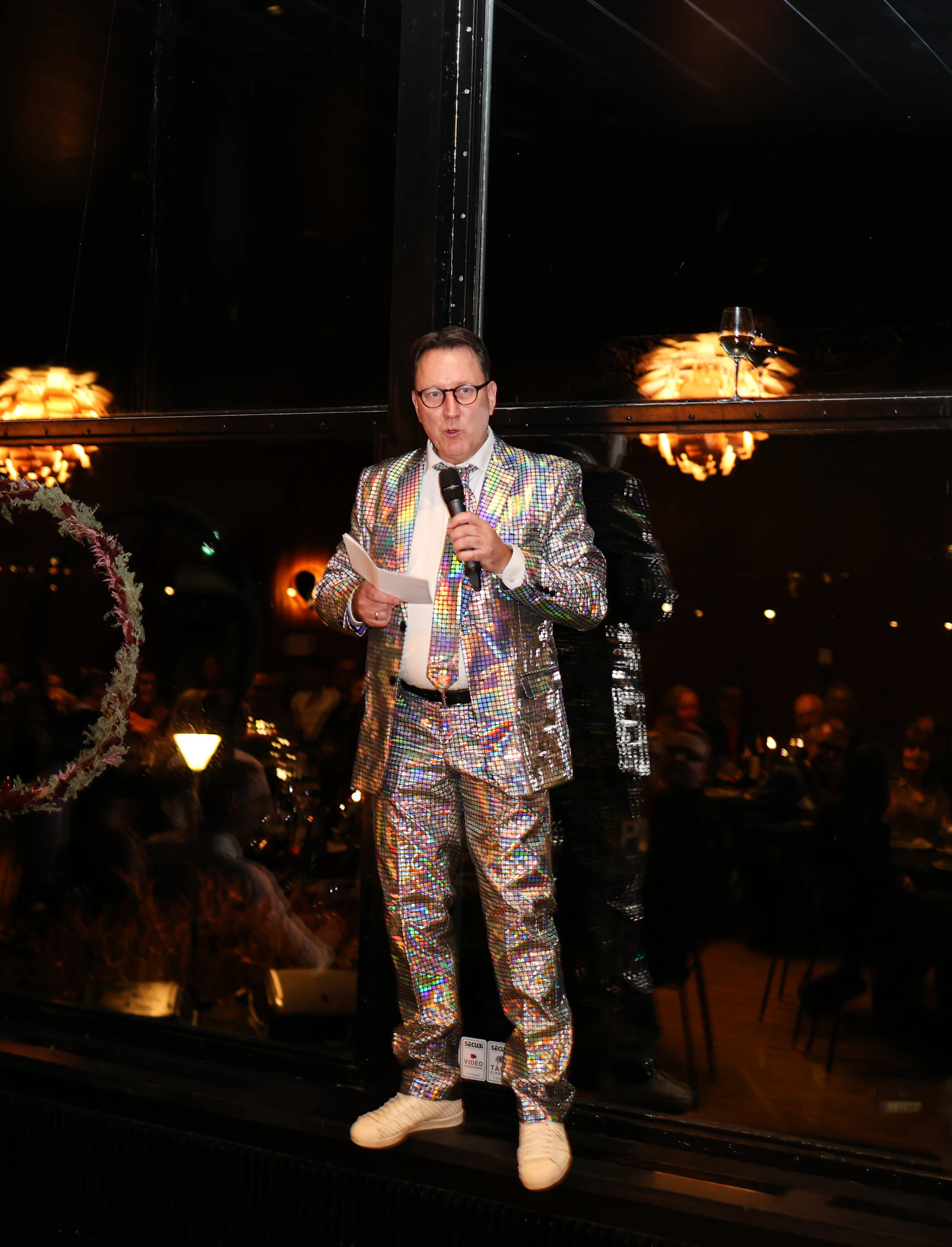 Professional event MC speaking into a microphone