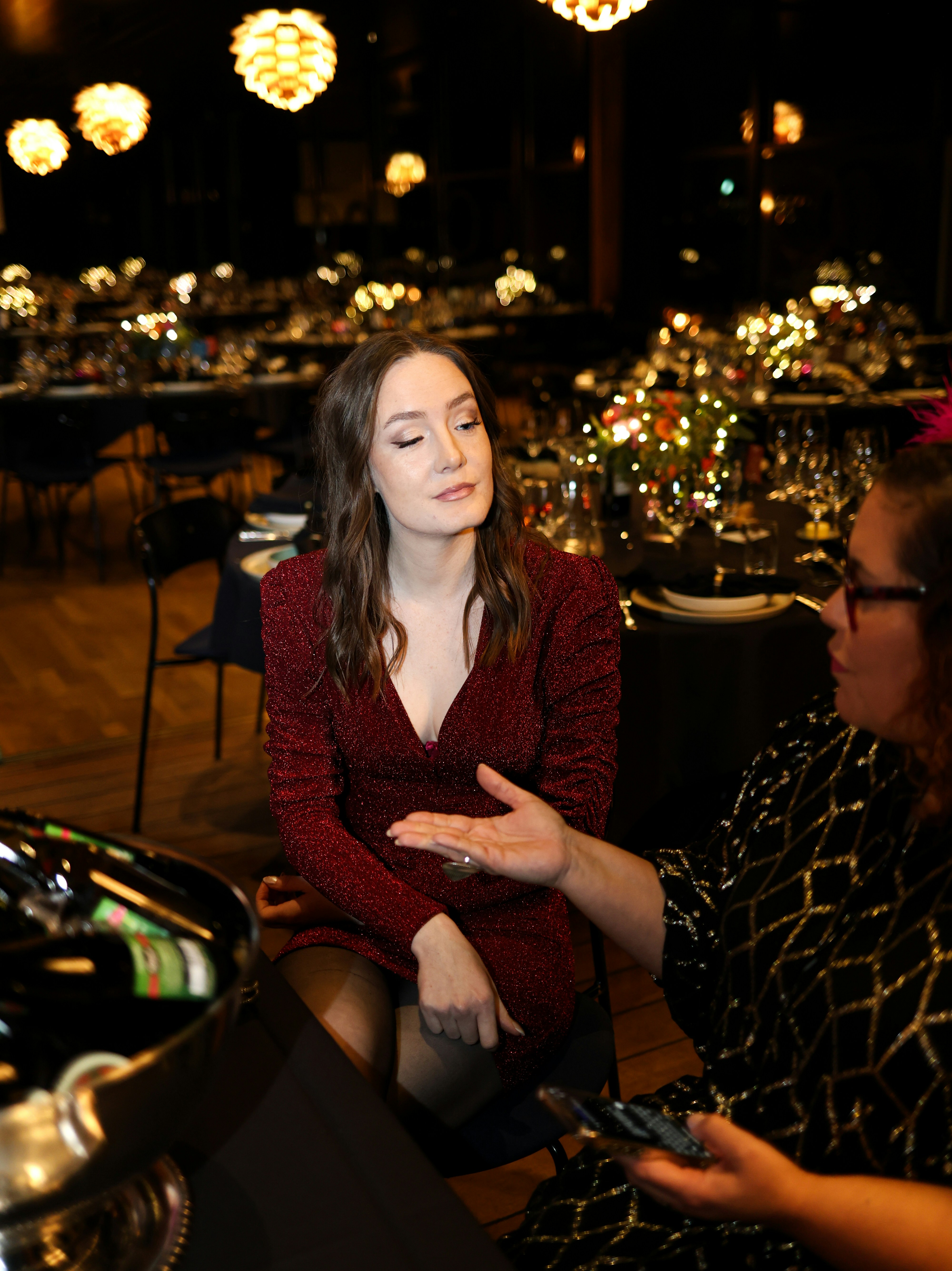 Young woman in a sparkly dress at a formal event
