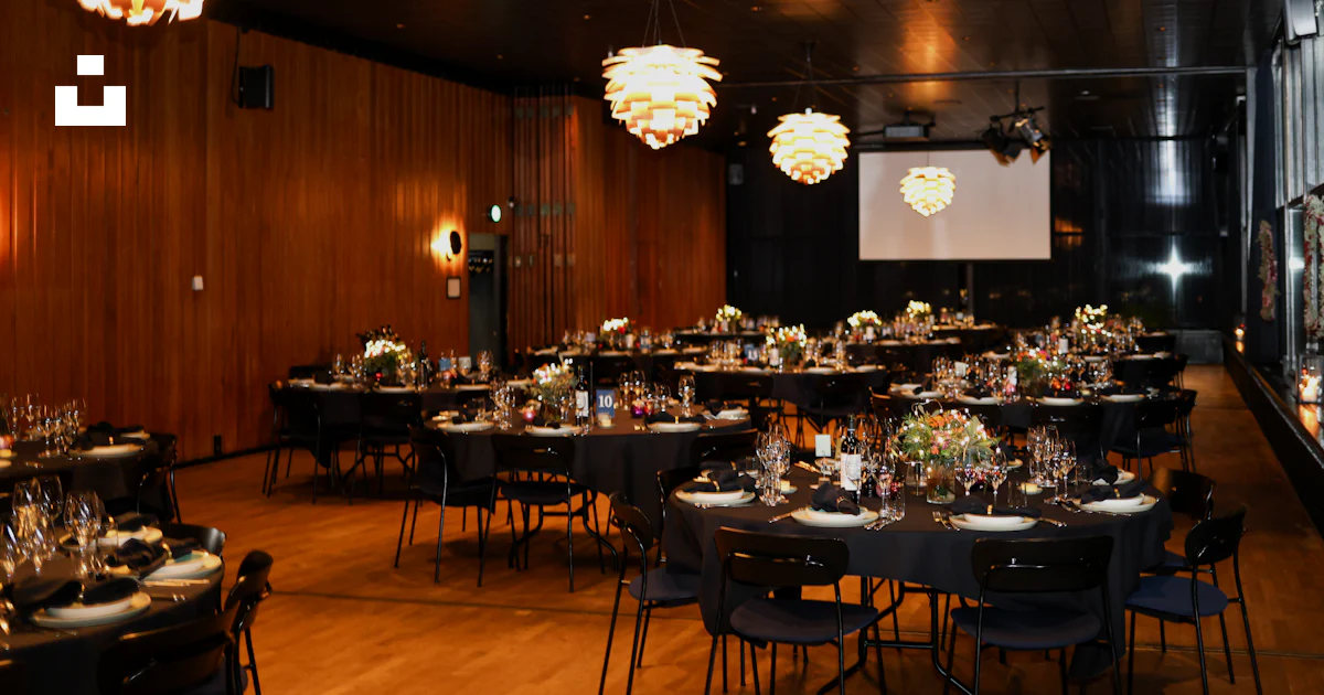 Round Table Event Activity Formal event setup with round tables and elegant lighting photo – Free ...