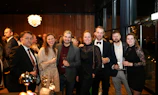A group of people dressed formally at an event