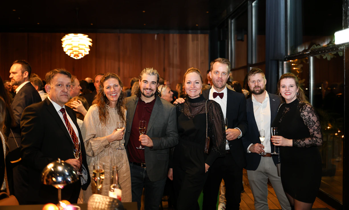 A group of people dressed formally at an event
