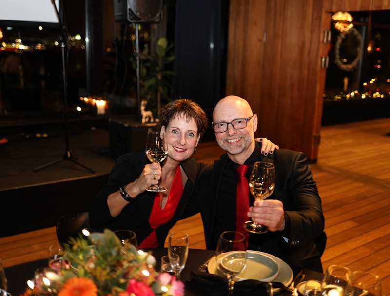 couple toasting with wine at formal event