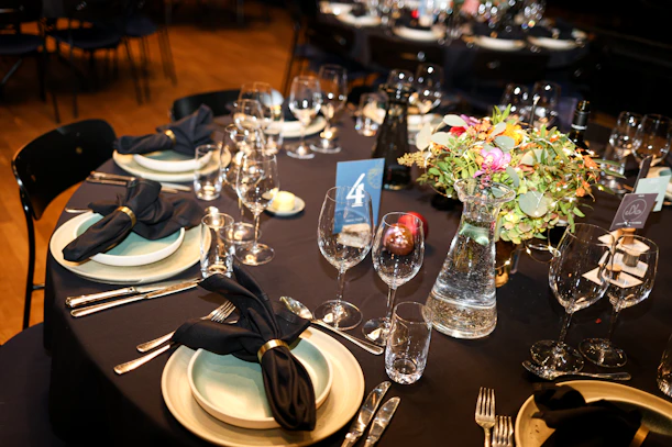 Elegant table setting with floral centerpiece and wine glasses