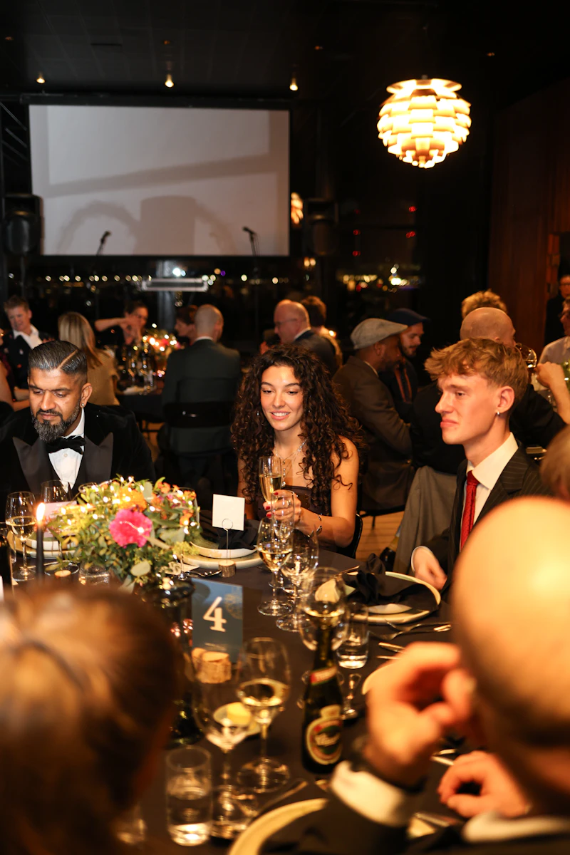 A formal dinner with floral centrepieces