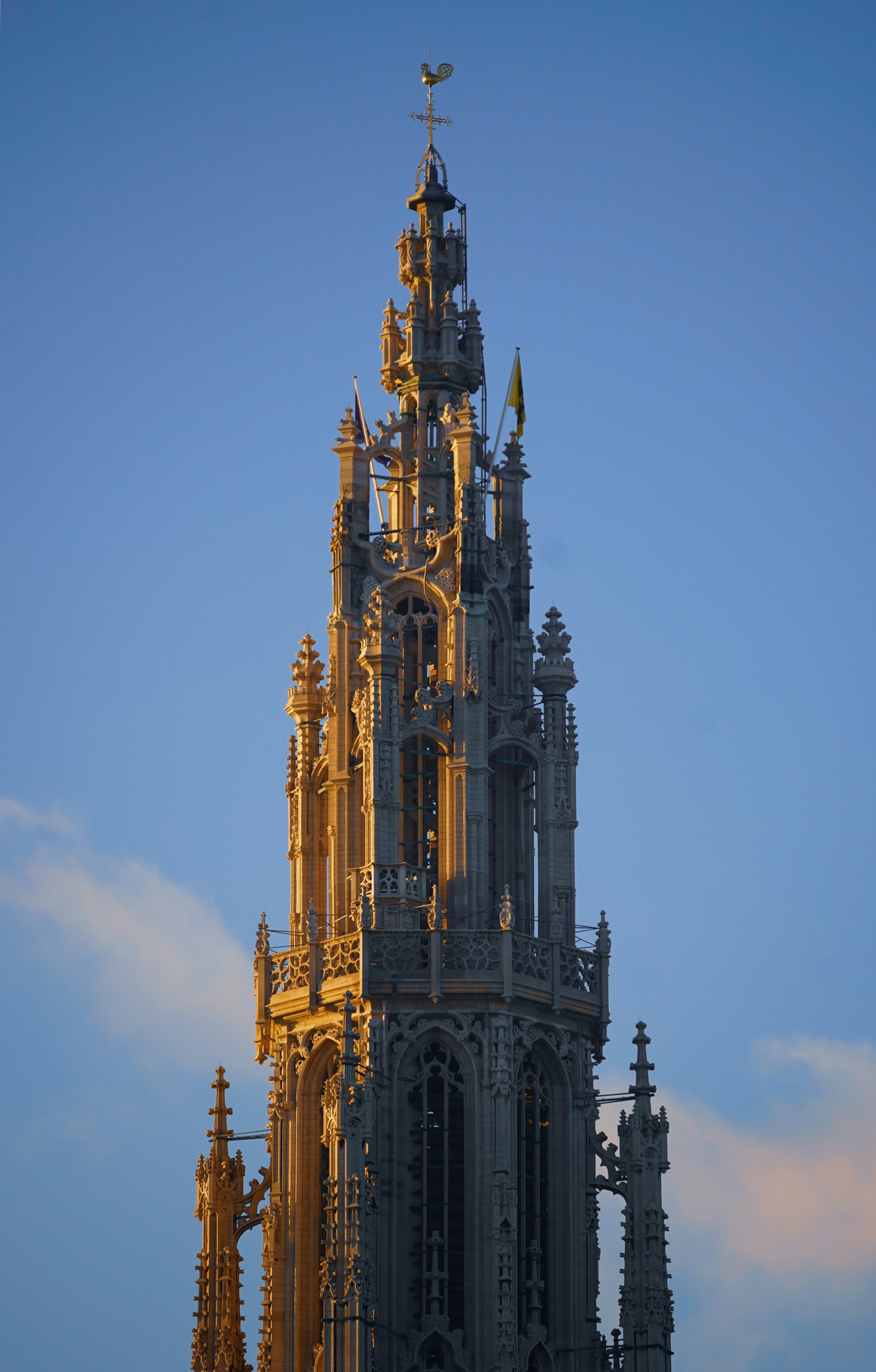 Ornate gothic tower illuminated by golden sunlight