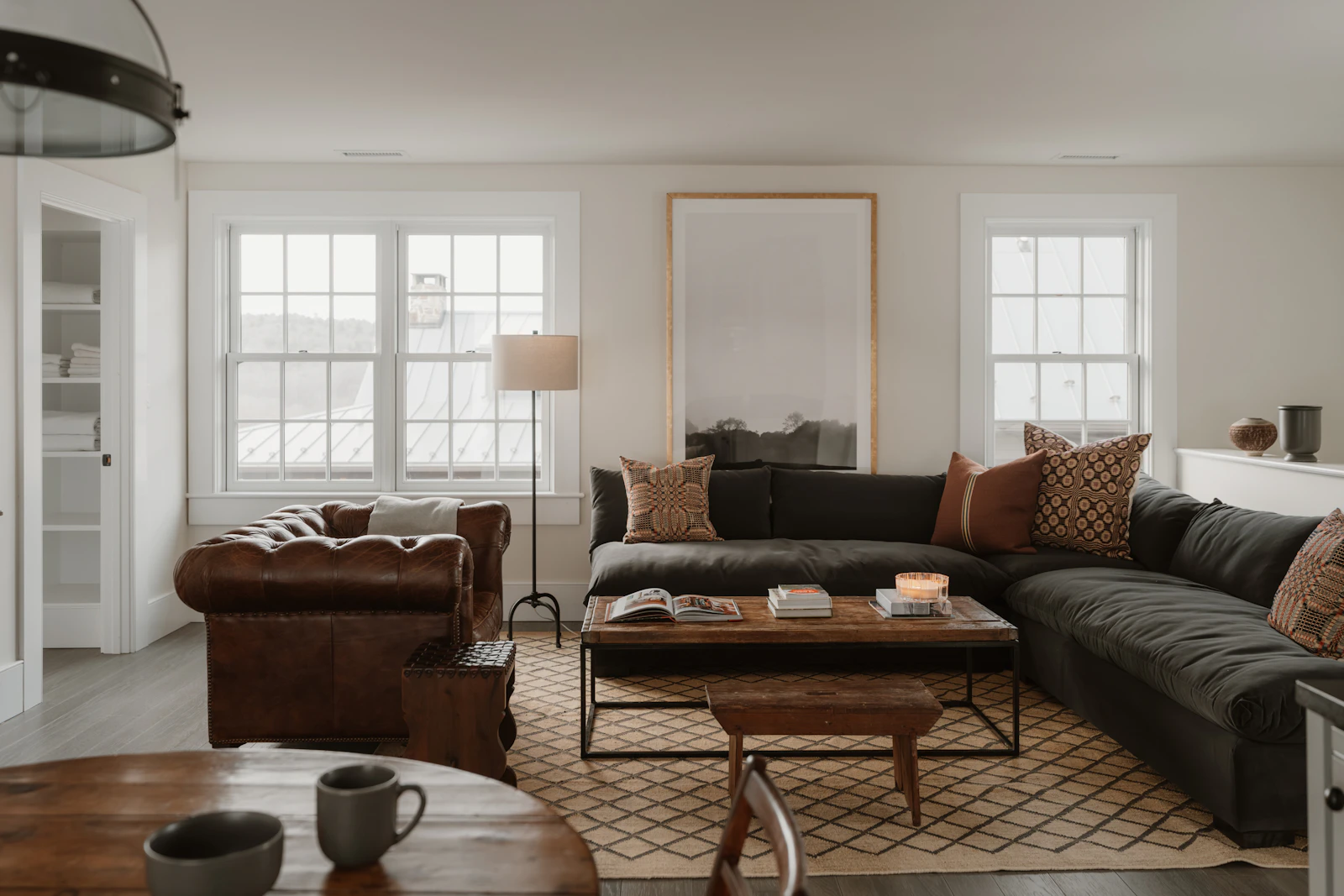 Camps Bay villa living room: soft plaster walls, deep seating, mountain light.