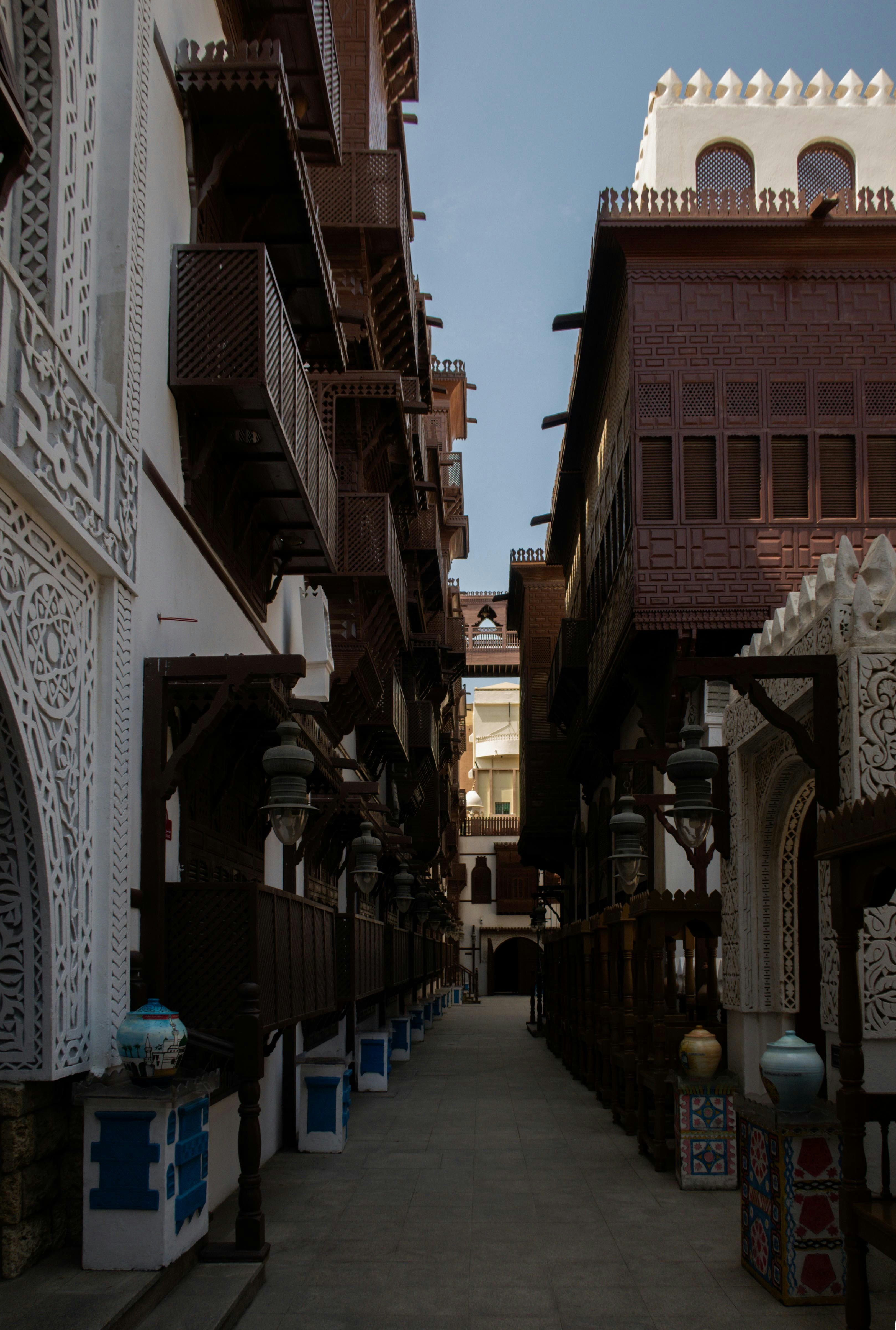 Narrow alleyway between traditional wooden buildings.