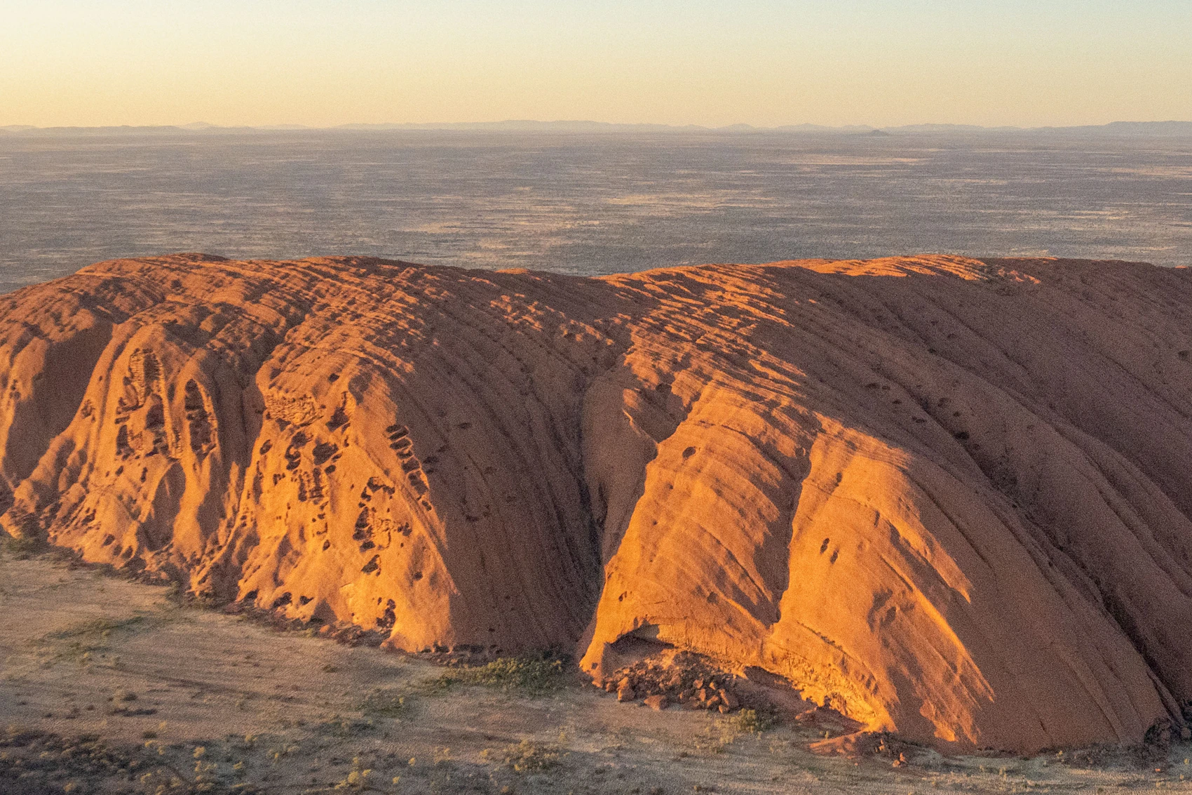 Uluru glowing in warm evening light in Australia’s Red Centre