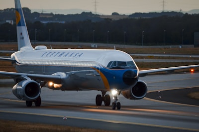 Airplane on a runway with lights on