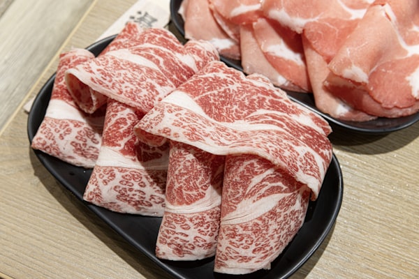 Marbled thin-sliced beef ready for the pot