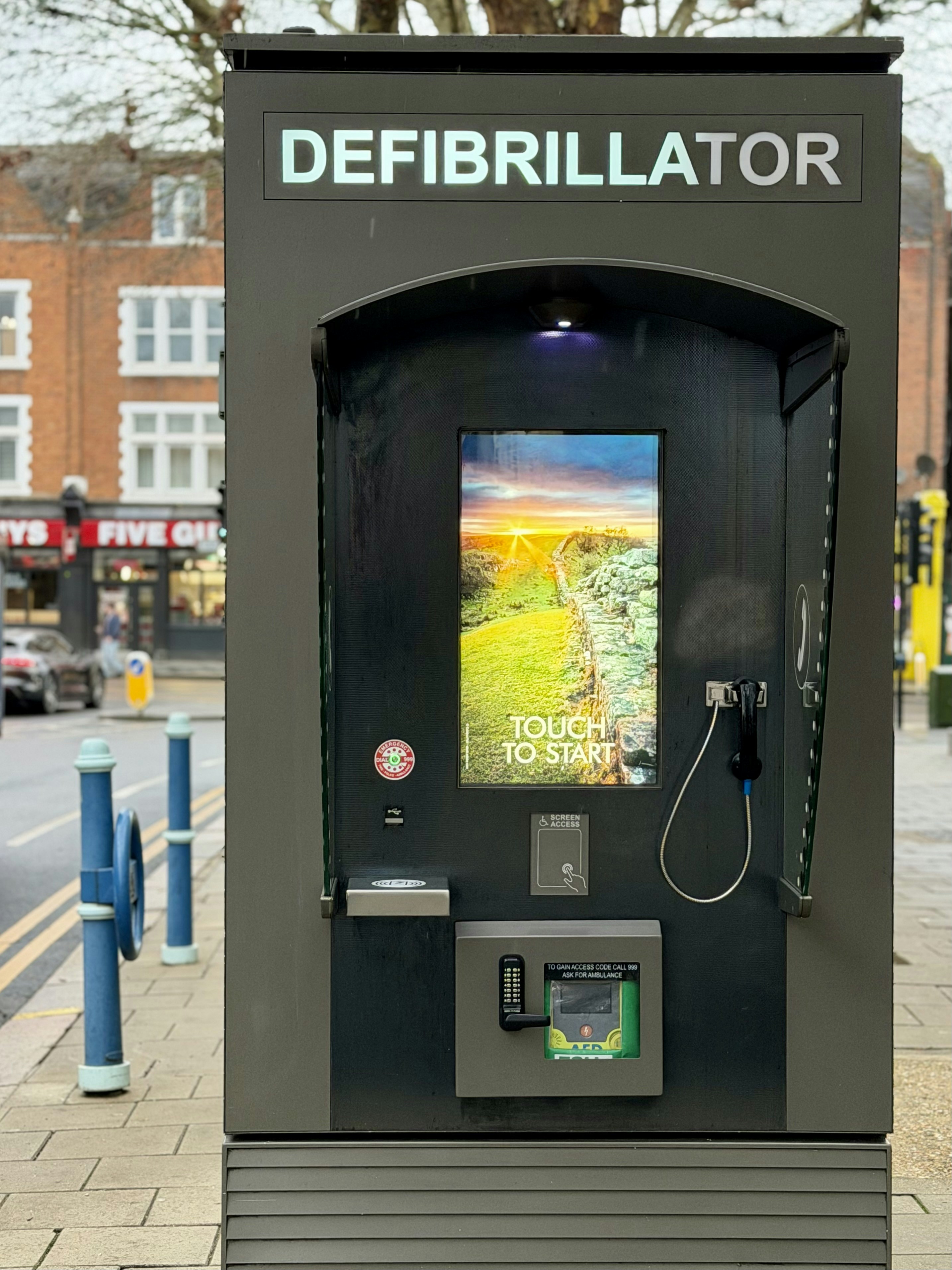 Public defibrillator unit on a street.